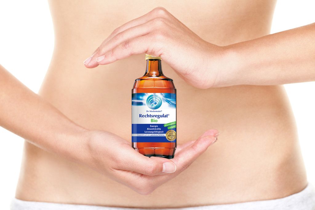 Balanced diet - healthy eating and stomach health concept. Woman holding hands over stomach as yin yang as symbol of healthy balanced diet and health. Young female belly close up.